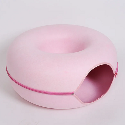 Pink felt tunnel nest for cats, a round donut-shaped hideaway with a zipper around the middle and a side opening