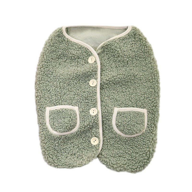 Green sherpa dog vest laid flat, with buttons and two pockets