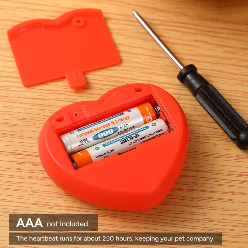 Heart-shaped heartbeat unit opened to show two AAA batteries (not included); runs for about 250 hours